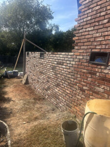 Adding brick to outside of master bedroom addition in South Carolina with general contractor near me Dennis Home Improvement