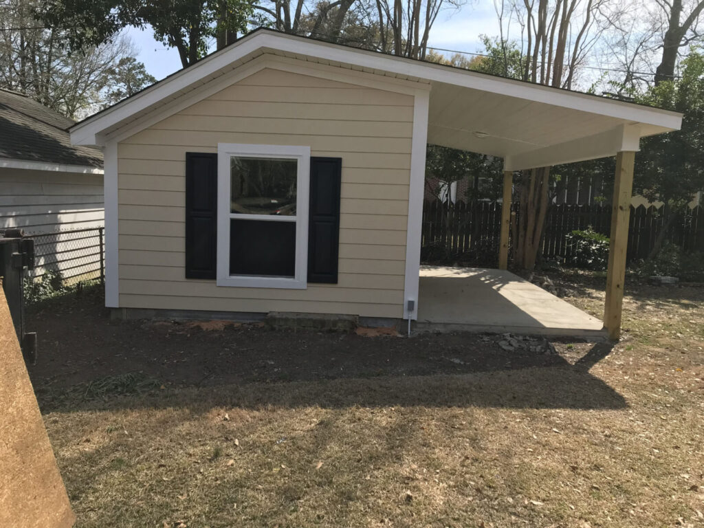 the rebuilt shed with new Hardie siding and windows built by window and door contractors near me Dennis Home improvement