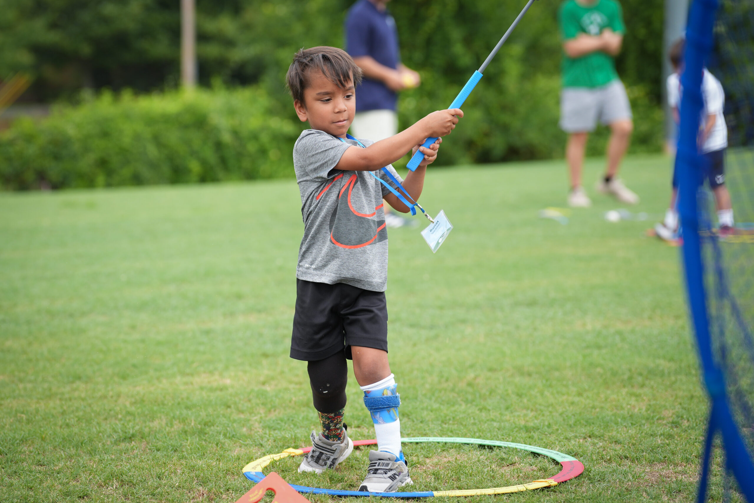 Children engaged at a G1 Golf station