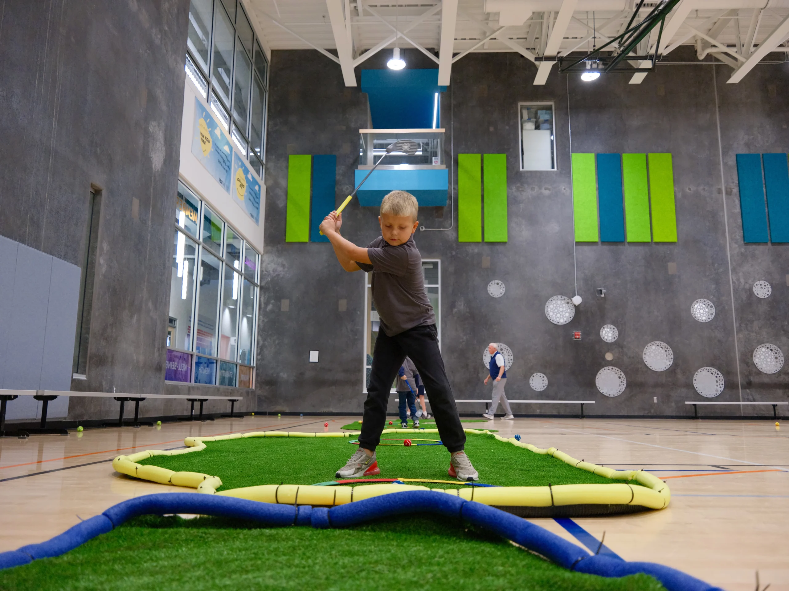 Six-station G1 Golf layout in a gymnasium