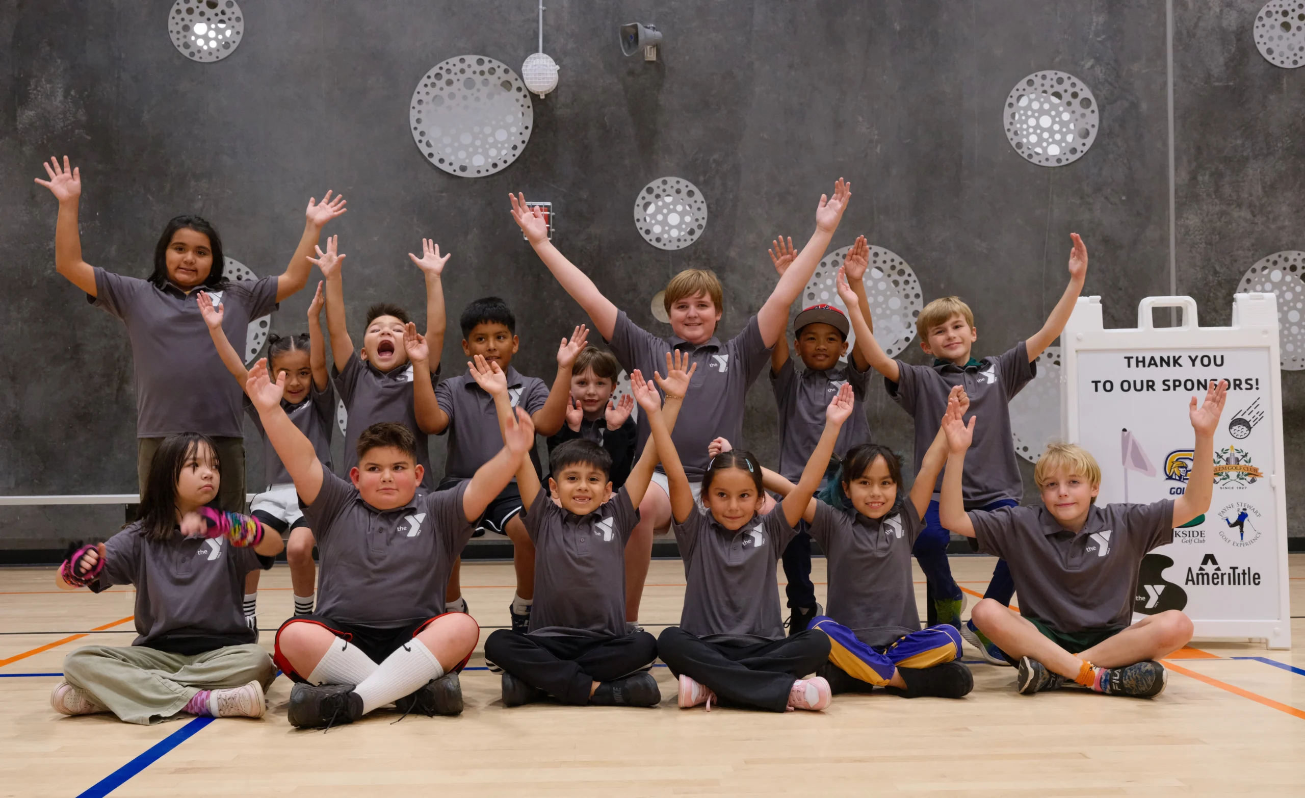Kids learning golf fundamentals at a G1 Golf experience
